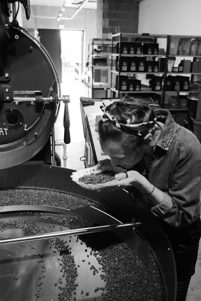 Woman roasting coffee